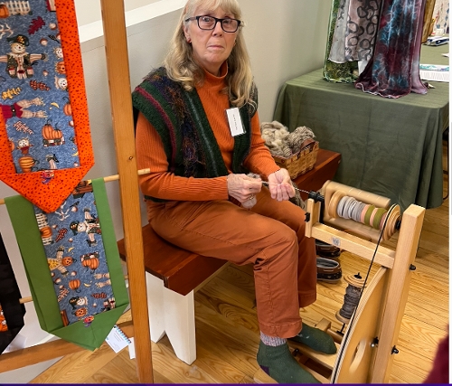 Michele Lawler demonstrates fiber work.