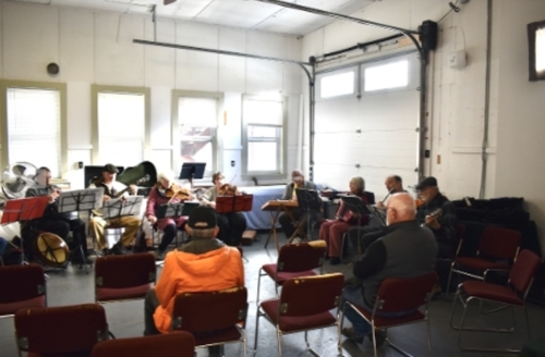 The Farley String Band performs at the Artists' reception.