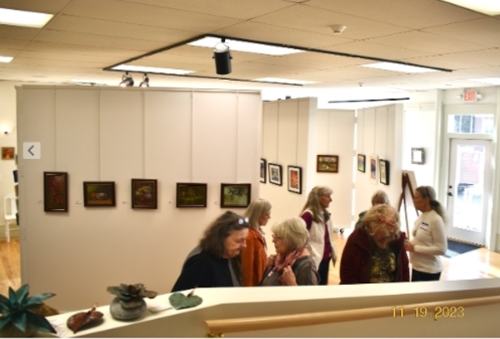 Marge visits with artists during the show.