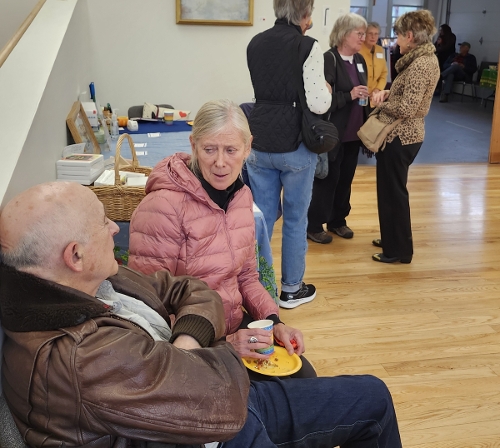 People mingle with music in the background.