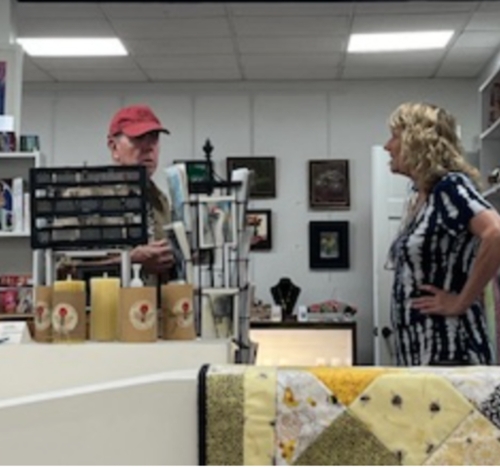 Jeanne chats with a customer in the gift shop.